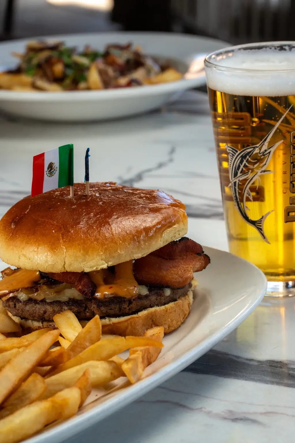 Bacon burger with a Mexican flag pick