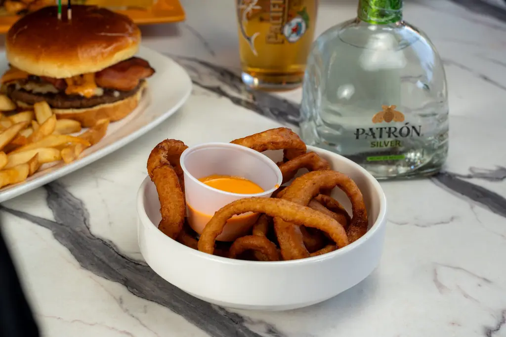 Onion rings with a Patron Silver bottle