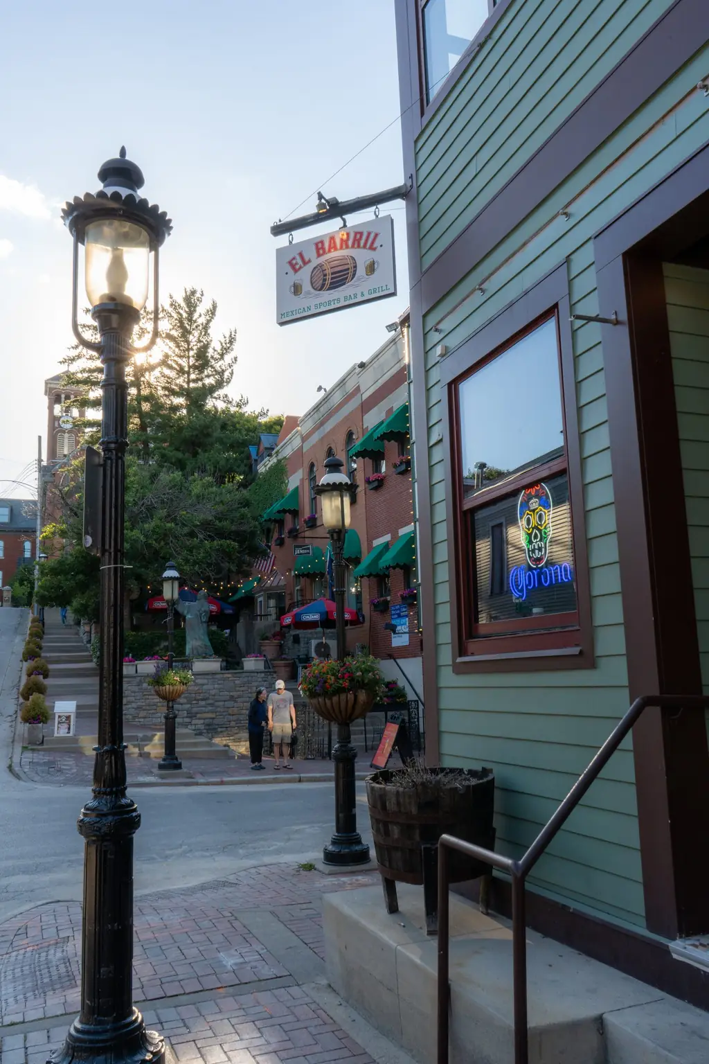 The El Barril building on a Mt Adams street with gas lamps and steps