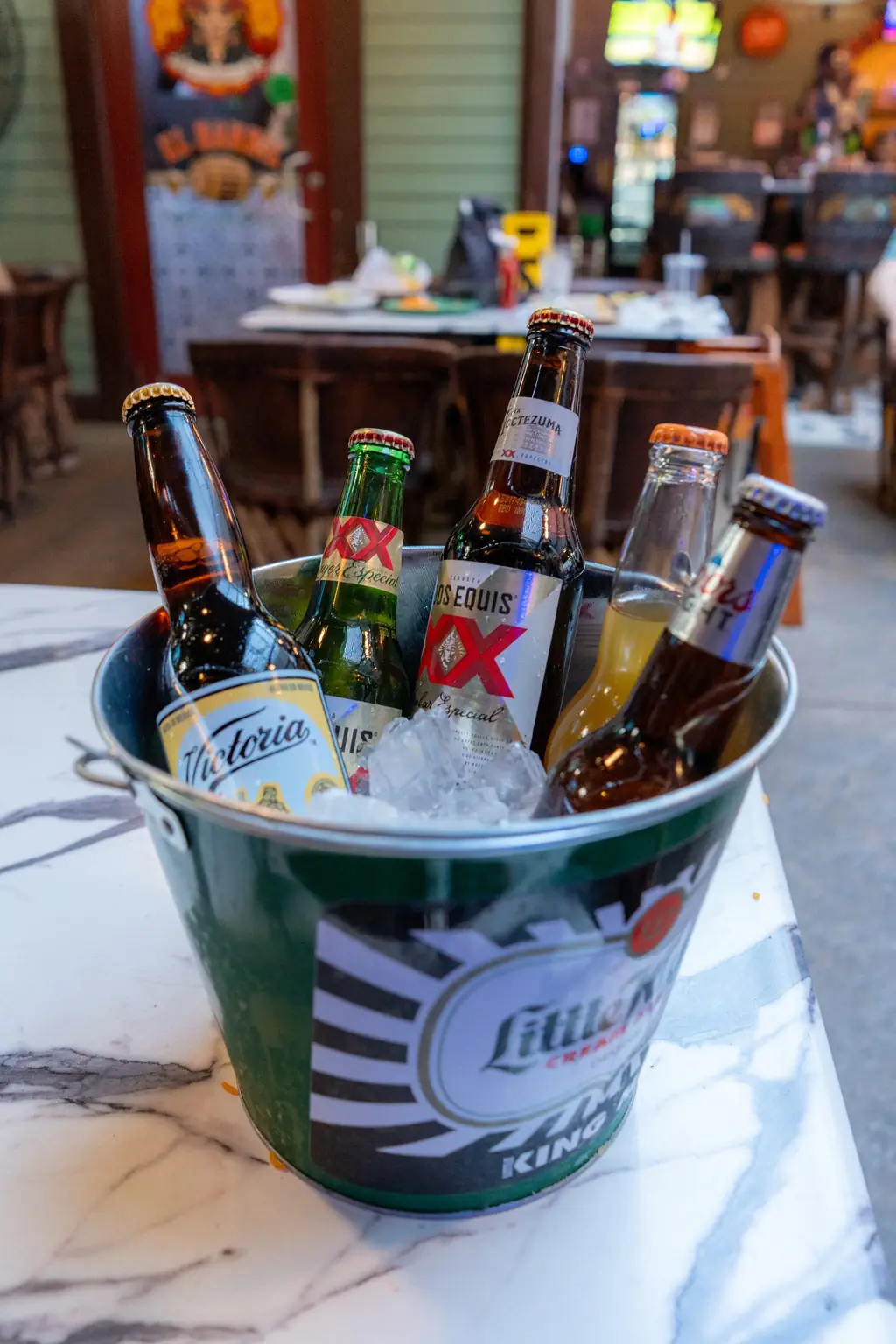 A bucket of Mexican beers on ice