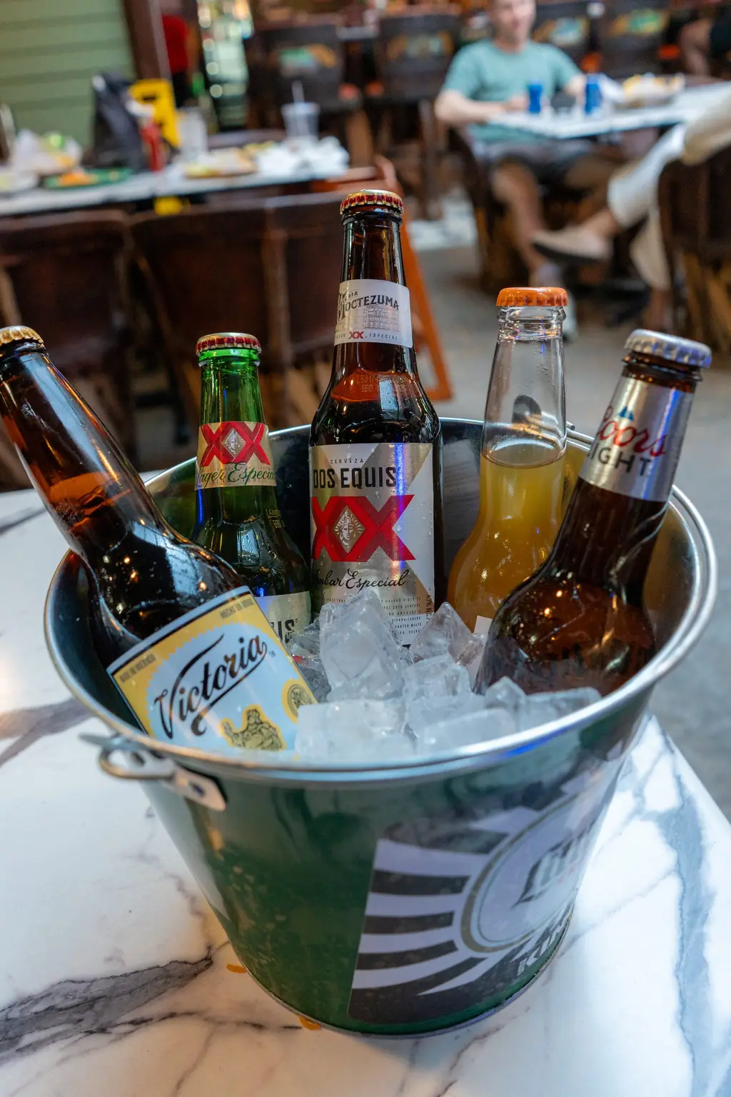 Bucket of Victoria, Dos Equis and Pacifico on ice