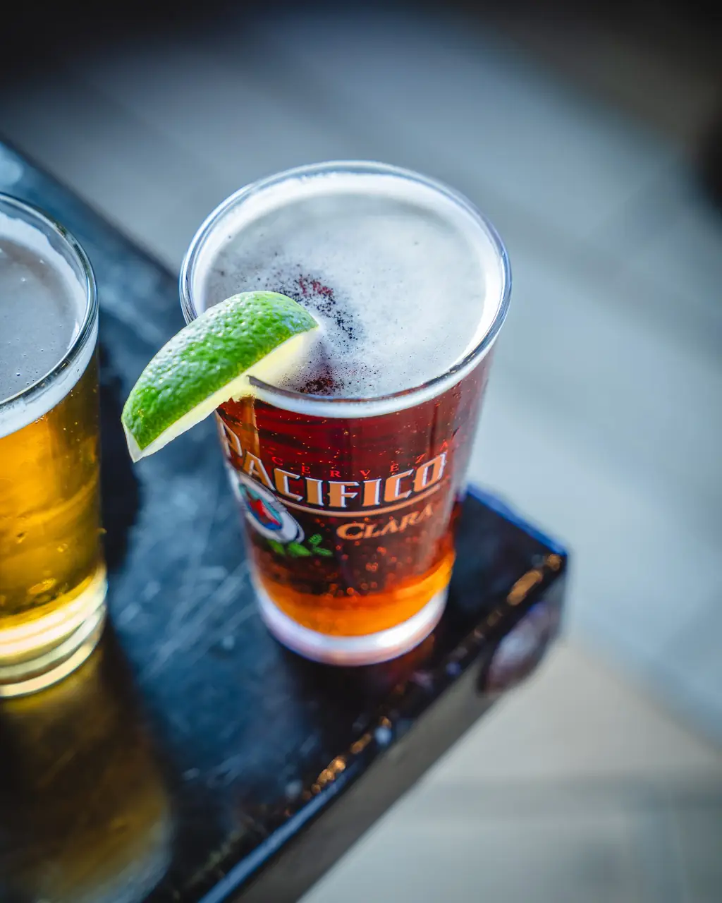 A Pacifico pint with lime