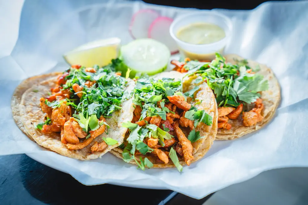 Street tacos with cilantro, lime and salsas