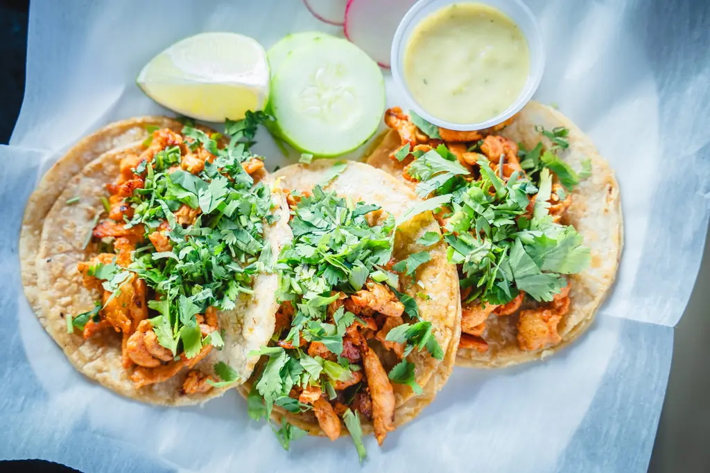 Street tacos with cilantro, lime and salsas