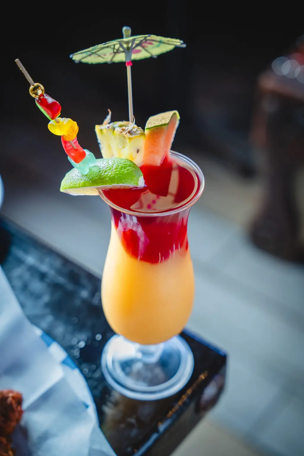 Layered cocktail with an umbrella